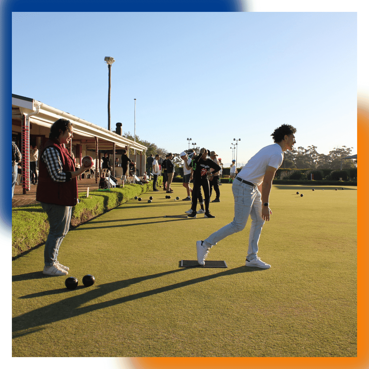 DSL Telecom team member actively playing in the lawn bowls tournament by rolling the bowl on the  field.