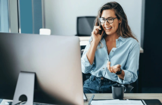 Businesswoman enjoying Liquid Intelligent Technologies true per second billing and low call rates