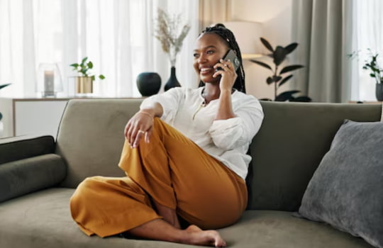 Woman at home using Telkom uncapped LTE internet with 300 on-net minutes in Helderberg