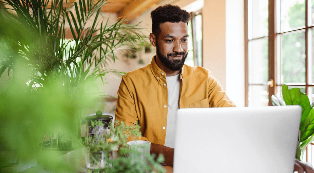 A man working from home with ease connected to his Vox MFN fibre internet connection