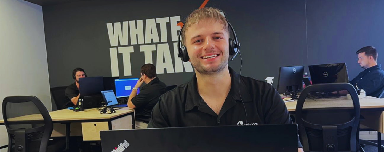 DSL Telecom employee smiling in the office in Somerset West DSL Telecom employee smiling in the Somerset West office, part of our Zoho internship programme in South Africa.