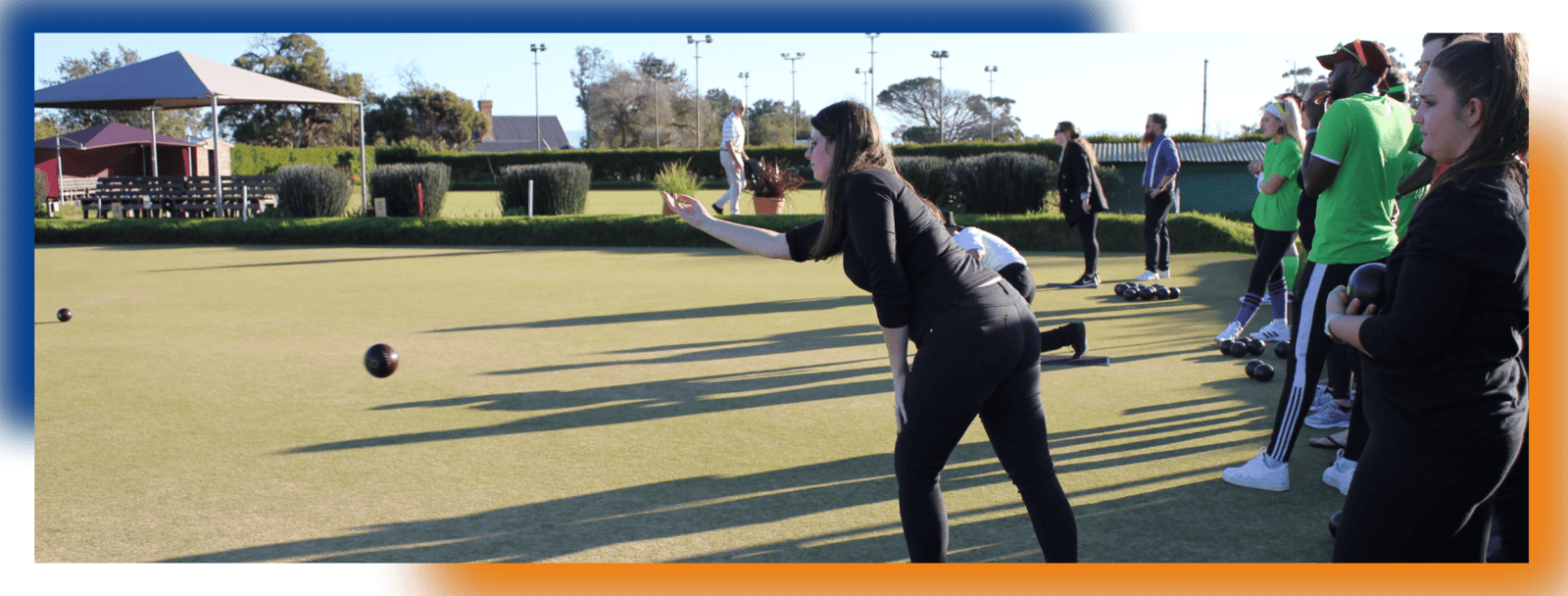 DSL Telecom team members participating in a lawn bowls tournament.