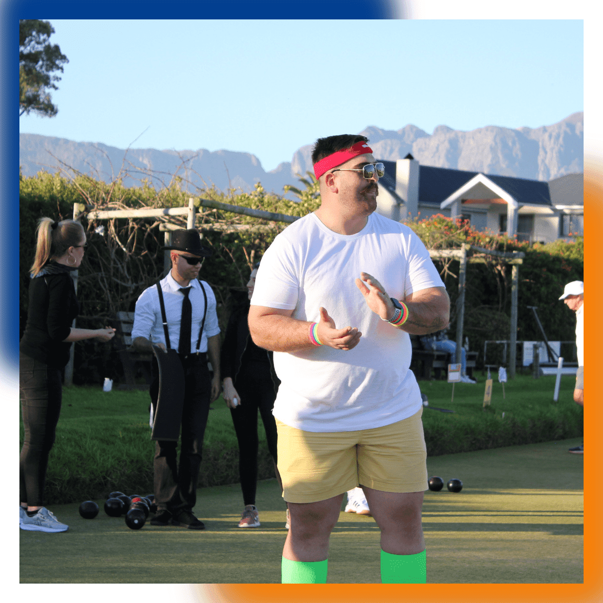 DSL Telecom team member showing team spirit through supporting team members during lawn bowls activity.
