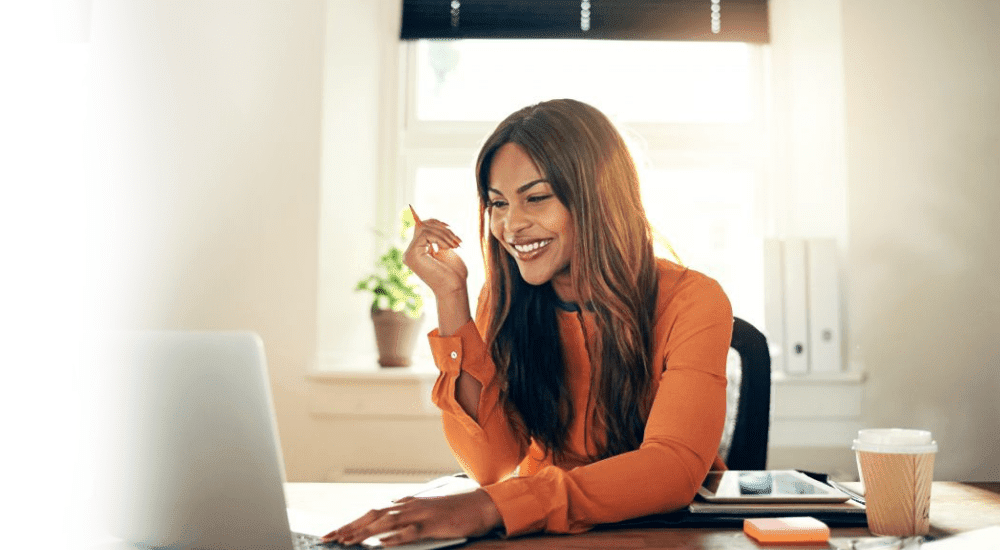 A business woman working on a laptop with a high-speed internet