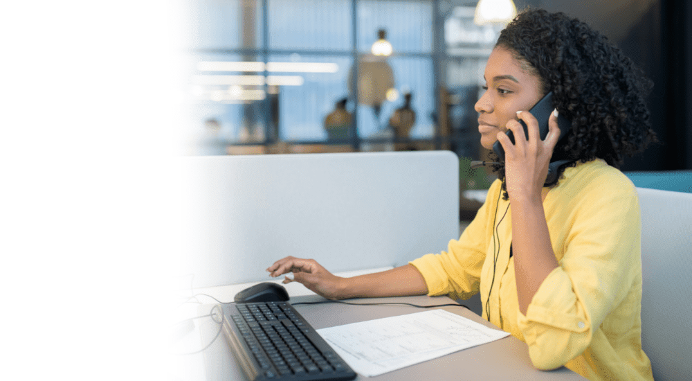 A lady making a high quality business phone call over a reliable VoIP service