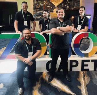 Team photo of DSL Telecom by the Zoholics Cape Town welcome banner