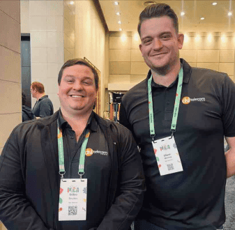 DSL Telecom members posing cheerfully at Zoho's annual user conference 2024