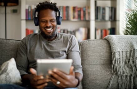 Man watching his favourite shows smoothly with a high-speed Telkom Vuma fibre connection.