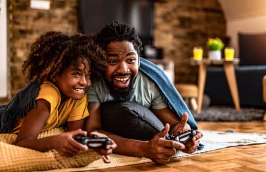 Family playing online video games with a stable and fast Vox Telkom LTE connection in South Africa
