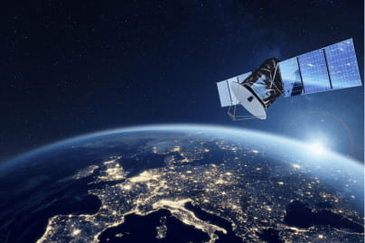 A low Earth orbit (LEO) satellite travelling around Earth, with the planet's curved surface visible below against the darkness of space.