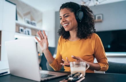 A lady making a VoIP call from home using a reliable Telkom Link Africa fibre connection in South Africa.