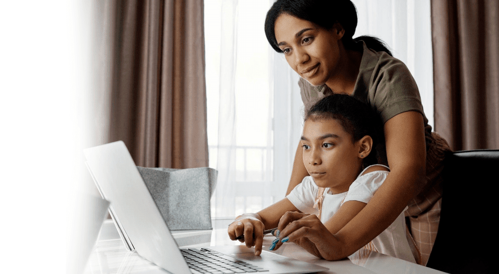 A woman and her daughter on a video call connected to high-speed fibre