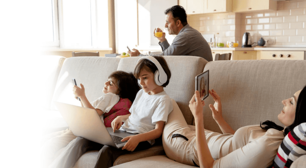 A family connecting to their fibre internet using multiple devices