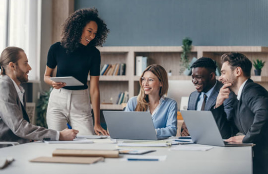Team collaborating in an office using Liquid fibre to stay productive and run  efficiently