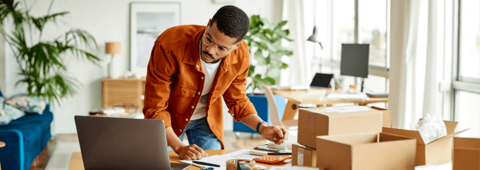 A man packing orders for his e-commerce store