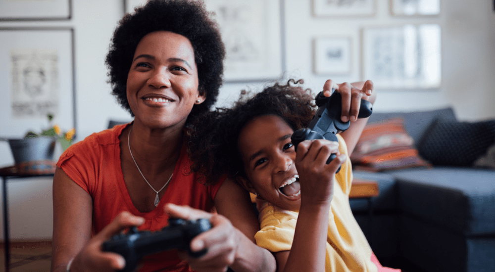 A family playing online video games connected to their Vox Vodacom fibre to the home internet connection