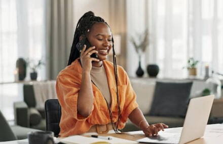 Woman working from home and making a call using Vox’s 60-minute free voice calling service