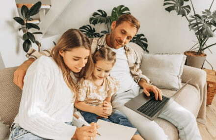 Family watching videos on their couch with Vox Balwin fibre-to-the-home internet connection