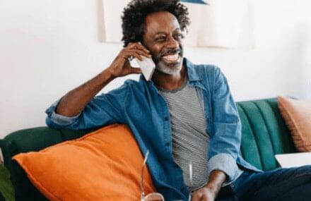 Man making calls using Vox fibre with 60 minutes of free voice services included
