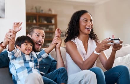 Family enjoying online video games with fast and reliable Vox Openserve fibre internet