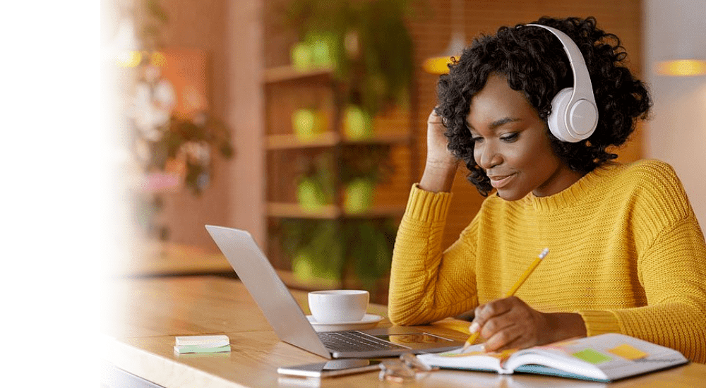 A young lady working from home with her uncapped Link Layer fibre internet connection