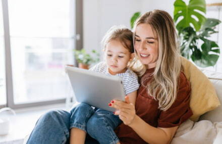 Mother and daughter playing on their tablet using a fast and reliable Vox Vodacom fibre connection.