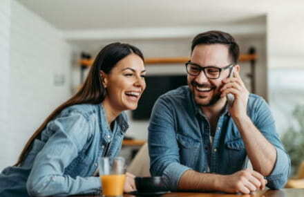 Couple browsing online at home thanks to Vox Vodacom’s stable and secure internet connection.