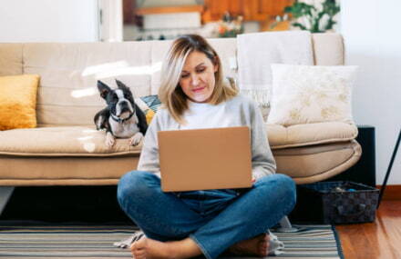Lady working from home on her laptop with Vox Vuma’s stable fibre internet connection