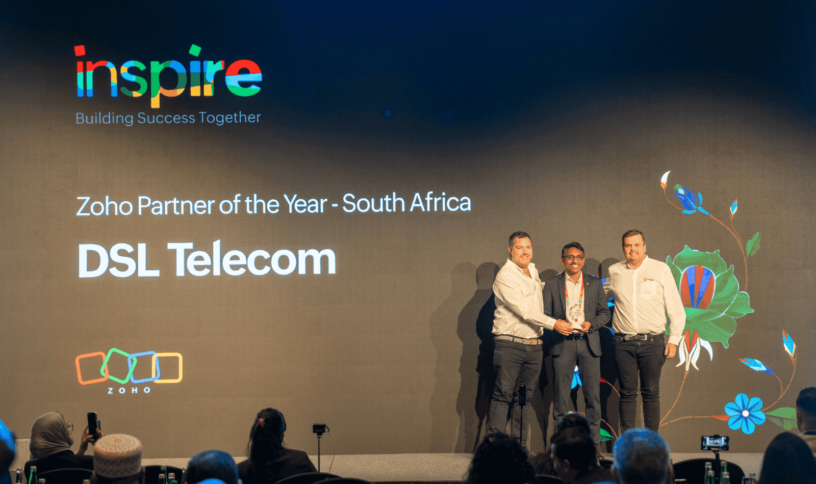 Dean Schreuder and Paul Wilson on stage, accepting the Zoho Partner of the Year Award 2025