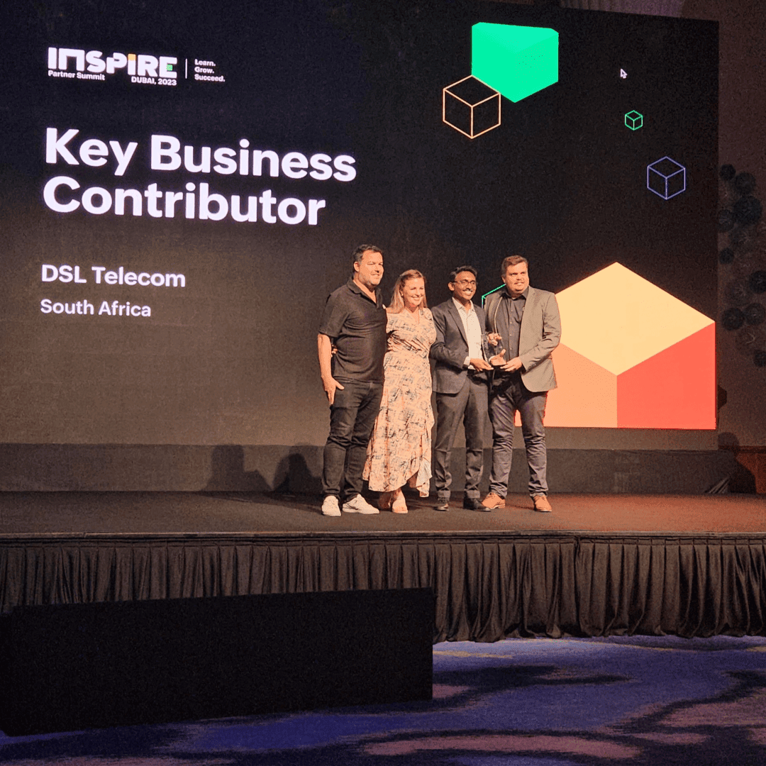 DSL Telecom Directors, Dean Schreuder, Danielle Schreuder, and Paul Wilson collecting their award at the Zoho Inspire event held in Dubai