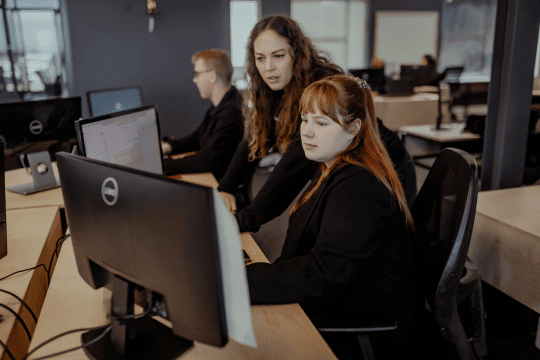 DSL Telecom employees solving Zoho challenges with one-on-one support sessions