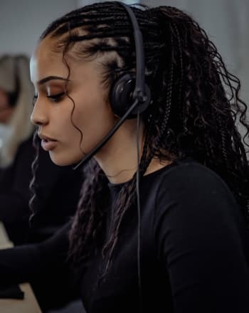 DSL Telecom employee assisting a client with cloud PBX service and VoIP solutions.