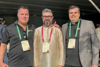 Dean and Paul from DSL Telecom standing with Ali Shabdar, Zoho's Regional Director for Africa and the Middle East.