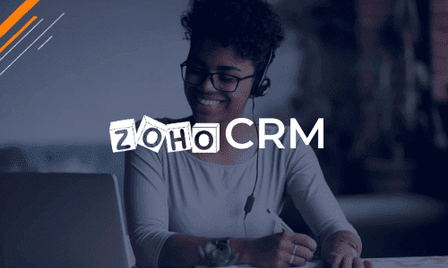 A woman smiling with her headset on in the Zoho CRM administrator training