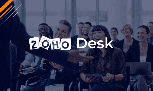 A group of people listening to a man giving a training session on Zoho Desk