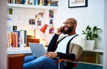 Man making calls at home using Vox’s 60-minute free voice calling service