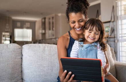 Mother and daughter streaming shows on a tablet using Vox TT Connect’s strong fibre-to-the-home internet connection in South Africa